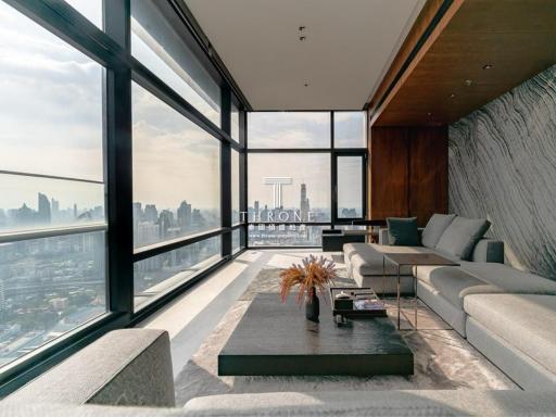 Modern living room with large windows and cityscape view