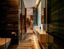 Modern interior corridor with sophisticated lighting and wood paneling