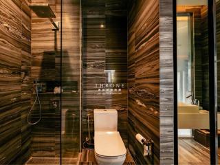 Modern bathroom interior with decorative stone tile walls