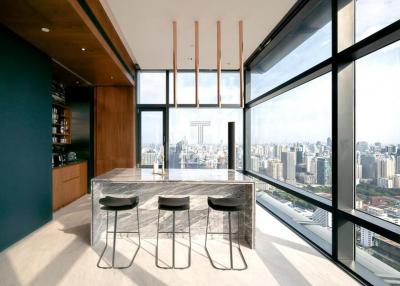Modern kitchen with large windows overlooking the city