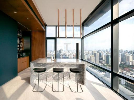 Modern kitchen with large windows overlooking the city