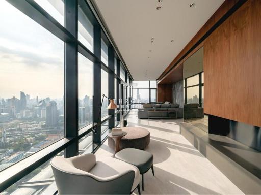Modern living room with floor-to-ceiling windows and city view