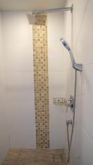 Modern bathroom shower with decorative tiles