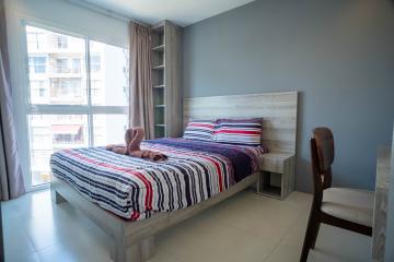 Modern bedroom with a view of the city