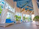 Modern building lobby with seating area and decorative pendant lights