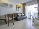 Modern living room with natural light and balcony access