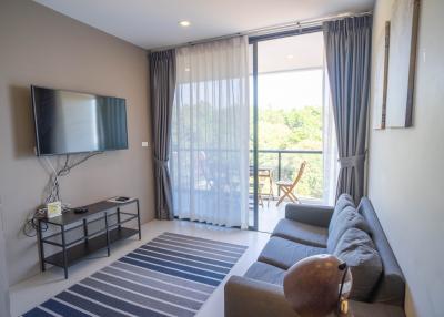 Modern living room with natural light and balcony access