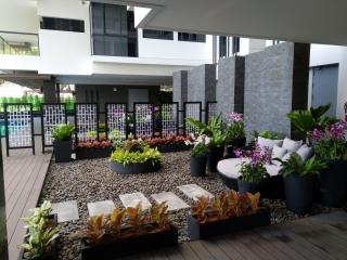 Elegant outdoor communal area with landscaped garden and seating