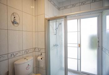 Bright and clean bathroom with shower and modern facilities