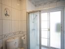 Bright and clean bathroom with shower and modern facilities