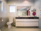 Modern bathroom interior with vanity and toilet