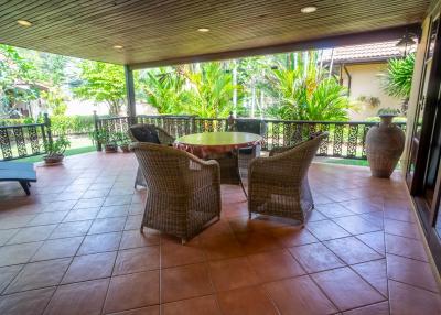 Spacious furnished patio with garden view in a residential property