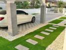 Modern driveway with covered carport and landscaped walkway