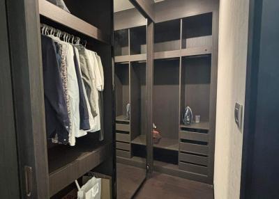 Spacious walk-in closet with custom shelving and modern lighting