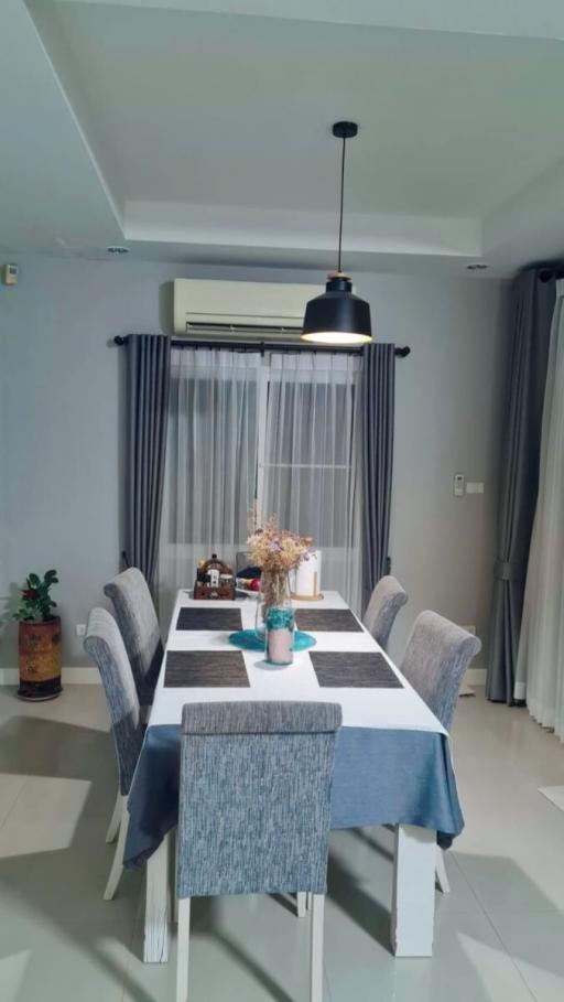 Modern dining room with a well-set table and elegant decor