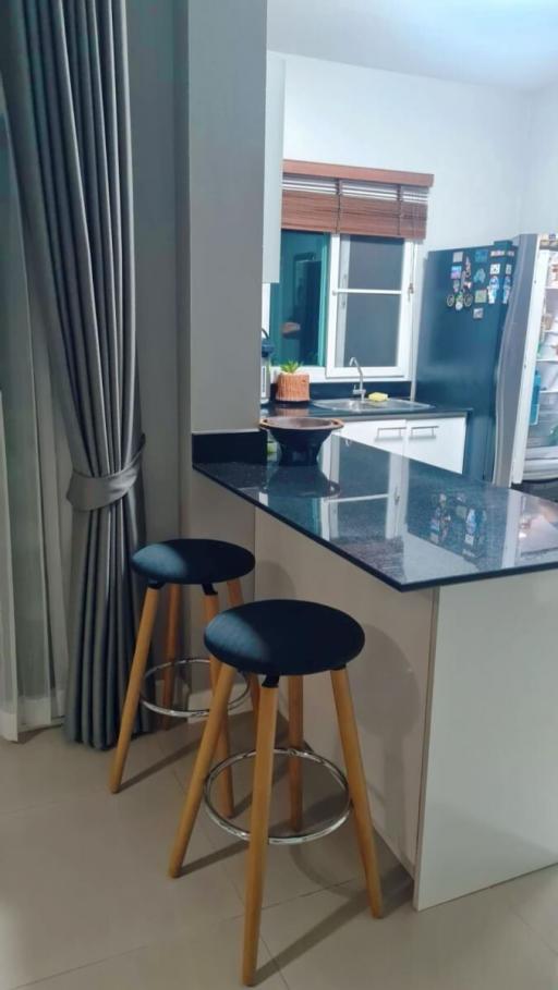 Modern kitchen with breakfast bar and stylish stools