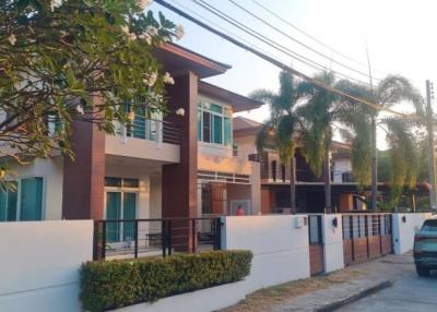 Modern two-storey residential home with balcony and driveway