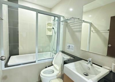 Modern bathroom with shower and bathtub combination