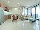 Modern apartment interior with open plan living room and kitchen, natural light, and clean design