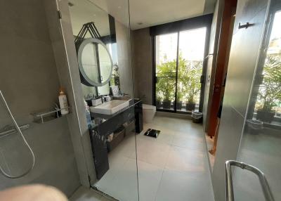 Modern bathroom with large mirror and shower