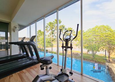 Home gym with exercise equipment and a view of the outdoors