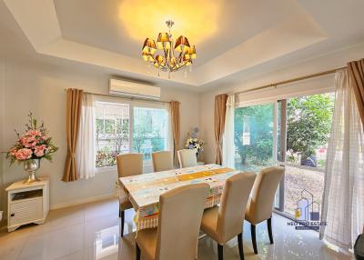Bright dining room with large window and garden view