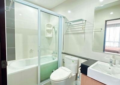 Modern bathroom with a shower, bathtub, and sink
