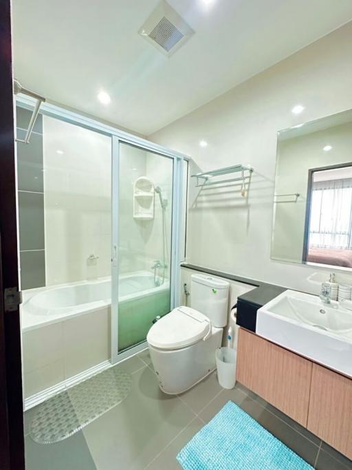 Modern bathroom with a shower, bathtub, and sink