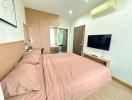 Cozy furnished bedroom with a large bed and modern amenities