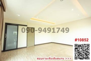 Spacious unfurnished bedroom with hardwood floors and ample natural light
