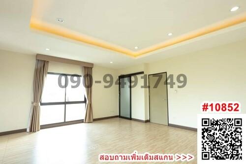 Spacious unfurnished living room with large windows and hardwood floors