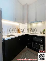 Modern kitchen with white cabinetry and built-in appliances