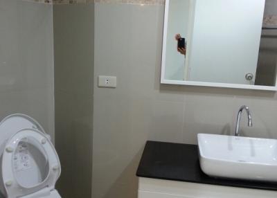 Modern bathroom interior with ceramic toilet and sink