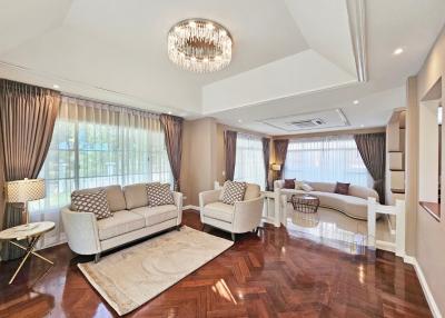 Spacious and elegantly furnished living room with natural light