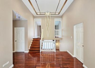 Elegant interior space with staircase and chandelier