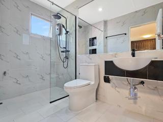 Modern bathroom with walk-in shower and stylish vanity