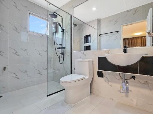 Modern bathroom with walk-in shower and stylish vanity