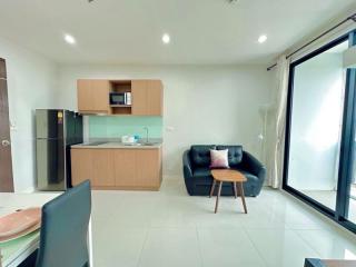 Modern living room and kitchenette with natural light