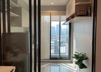 Modern apartment interior with balcony access and city view
