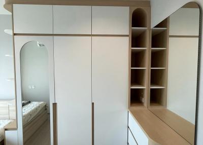 Modern bedroom with built-in wardrobe and dressing table