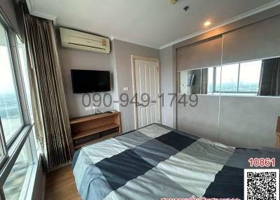 Spacious bedroom with large bed and modern amenities