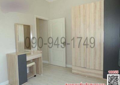 Modern minimalistic bedroom with wooden wardrobe