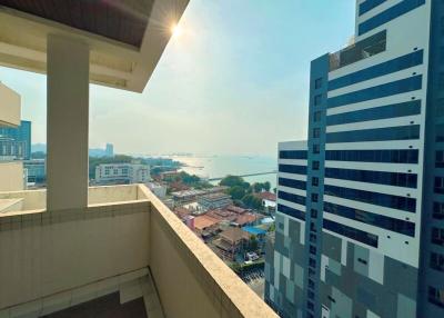 High-rise apartment balcony with a city and water view