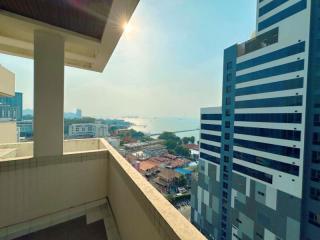 High-rise apartment balcony with a city and water view