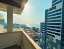 High-rise apartment balcony with a city and water view