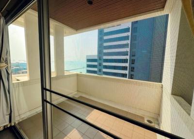 Modern balcony with a glass barrier and high-rise view