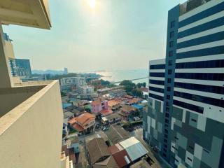 Expansive city and waterfront view from high-rise balcony