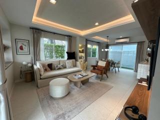 Spacious living room with modern furniture and ample natural light