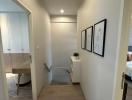 Bright hallway with wooden flooring and modern framed artwork