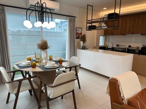 Modern dining area with adjacent open kitchen